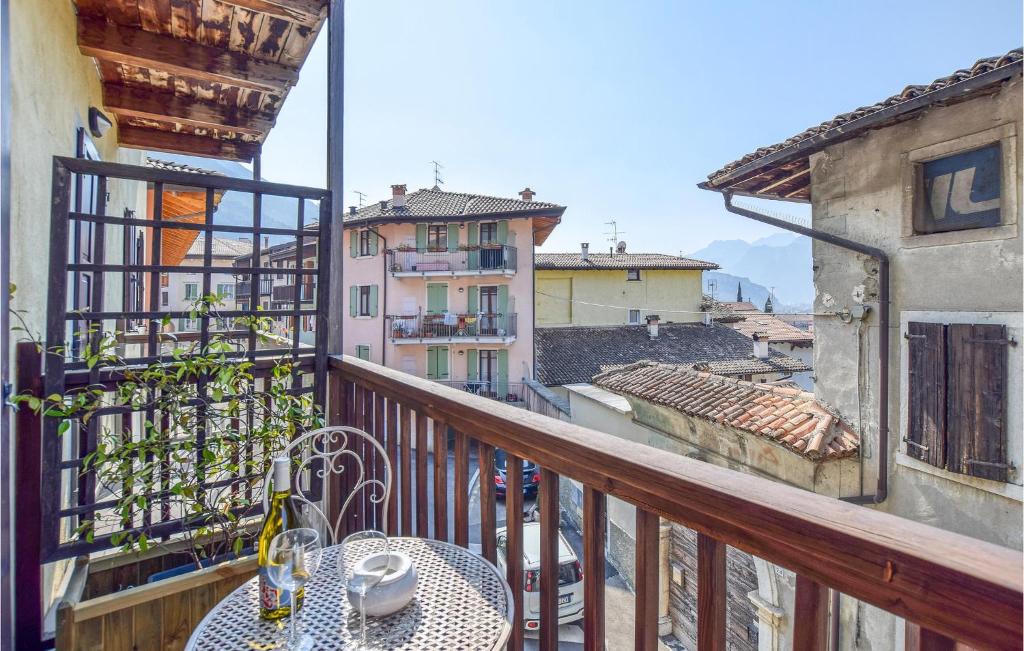 a balcony with a table and a view of a city at Nice Apartment In Vignole With Wifi in Arco