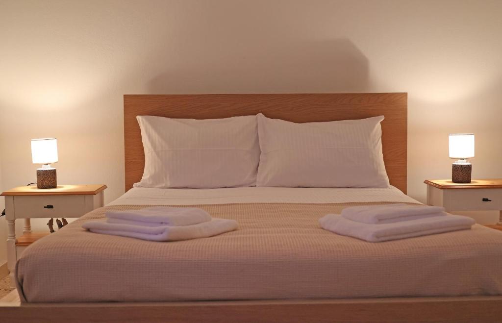 Postel nebo postele na pokoji v ubytování Aira Apartments