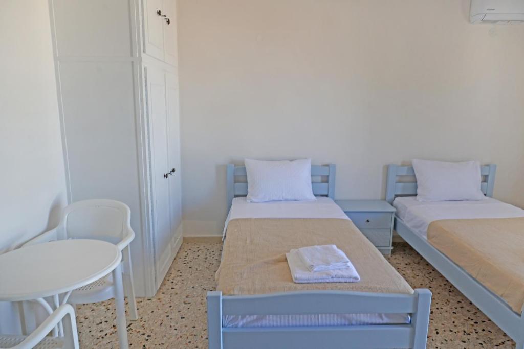 Postel nebo postele na pokoji v ubytování Aira Apartments