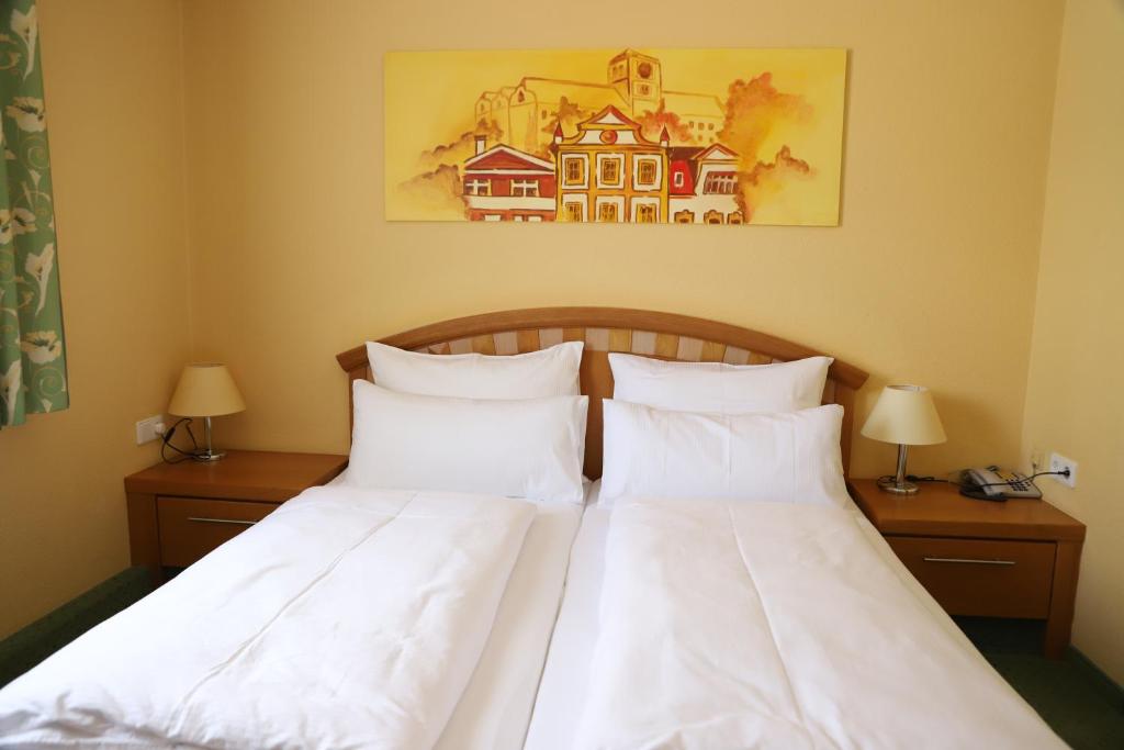 Postel nebo postele na pokoji v ubytování Brauhotel Weitra