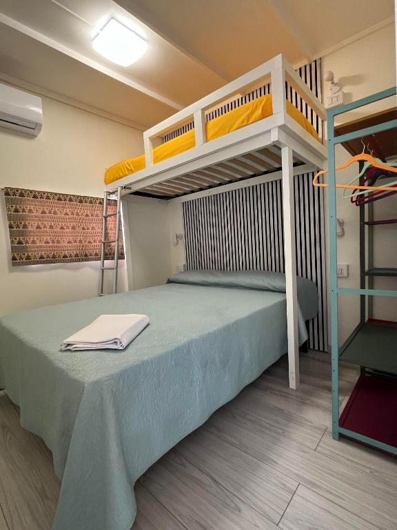 Postel nebo postele na pokoji v ubytování Camping Car Palmasera