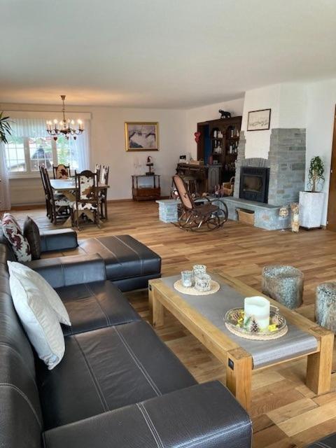 a living room with a couch and a table at Duplex Ferienwohnung Edelweiss in Grächen