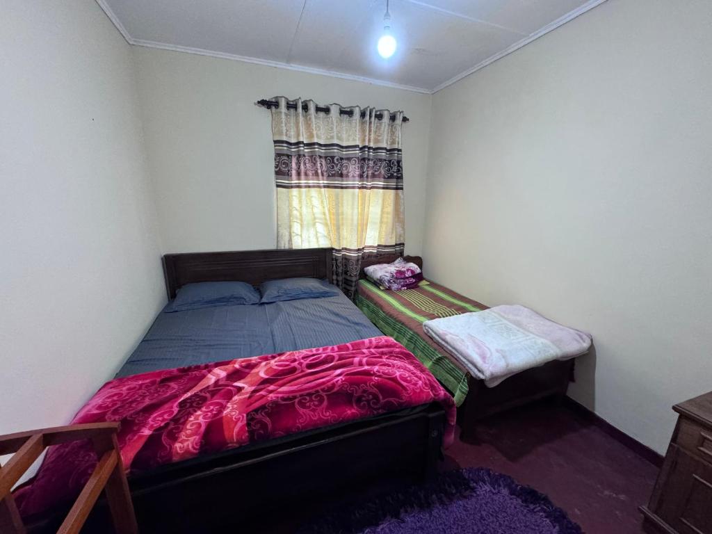 Postel nebo postele na pokoji v ubytování Trinity Guest-Inn