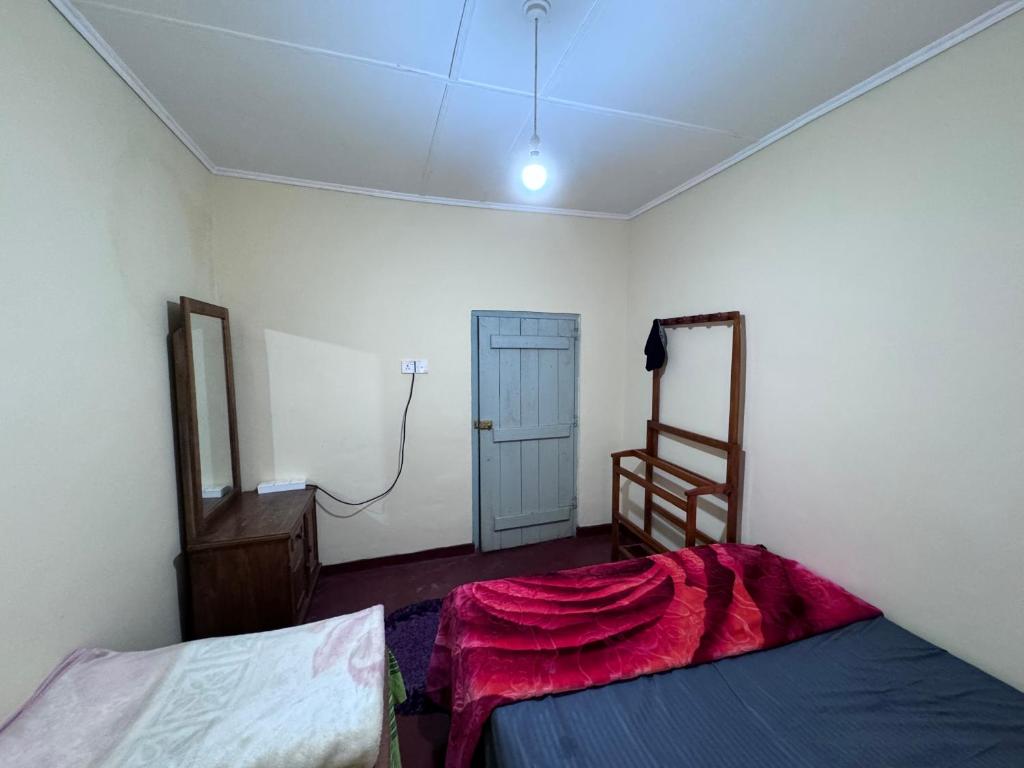 Postel nebo postele na pokoji v ubytování Trinity Guest-Inn