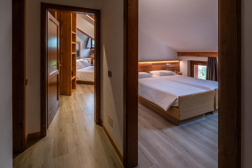Postel nebo postele na pokoji v ubytování Hotel Garnì Zanella