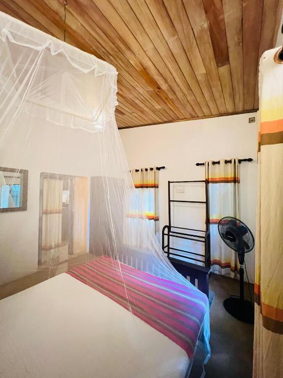 Postel nebo postele na pokoji v ubytování Krishan Villa