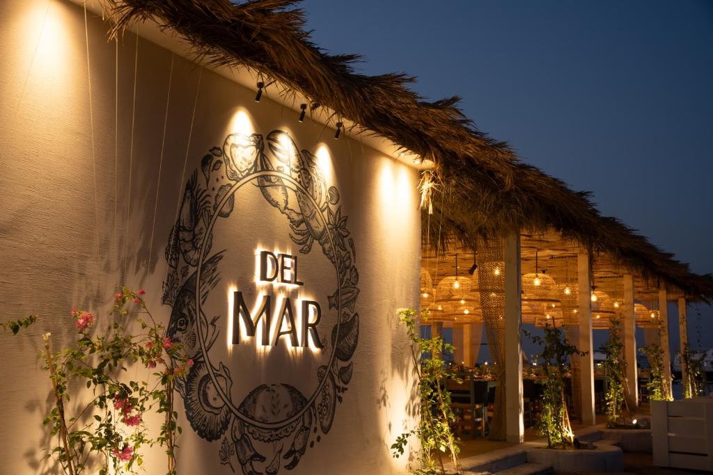 a sign on the side of a building with lights at Desert Rose Resort in Hurghada