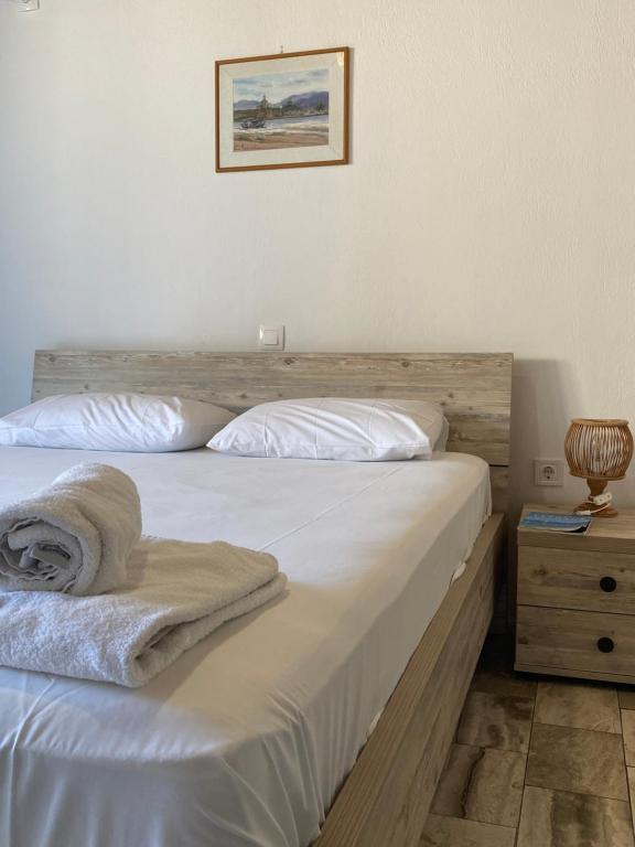 Postel nebo postele na pokoji v ubytování Pansion Vasso