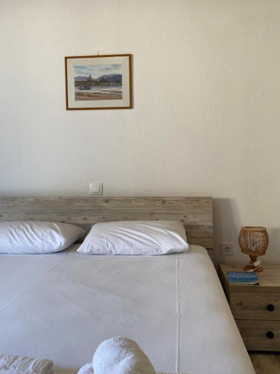 Postel nebo postele na pokoji v ubytování Pansion Vasso