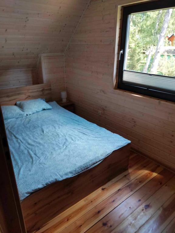 Postel nebo postele na pokoji v ubytování Domki AGA