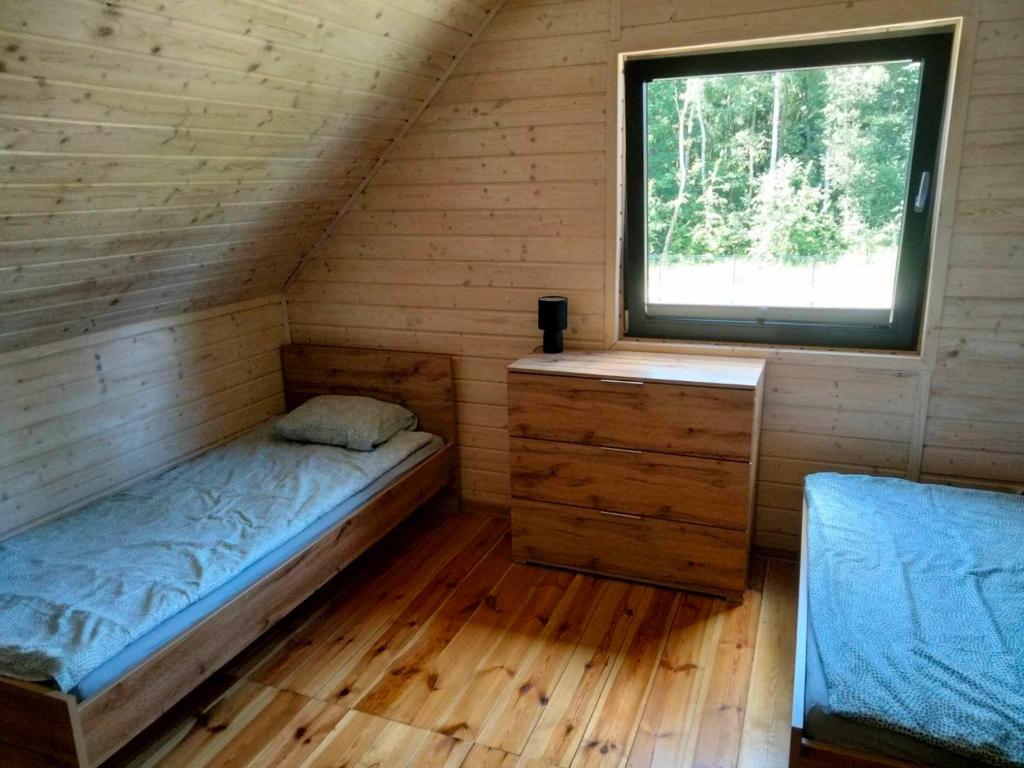 Postel nebo postele na pokoji v ubytování Domki AGA