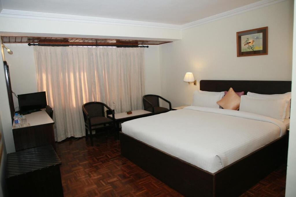 Postel nebo postele na pokoji v ubytování Hotel Holy Himalaya