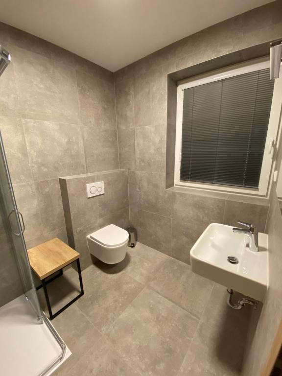 Koupelna v ubytování APARTMÁNY ATHEL KVILDA