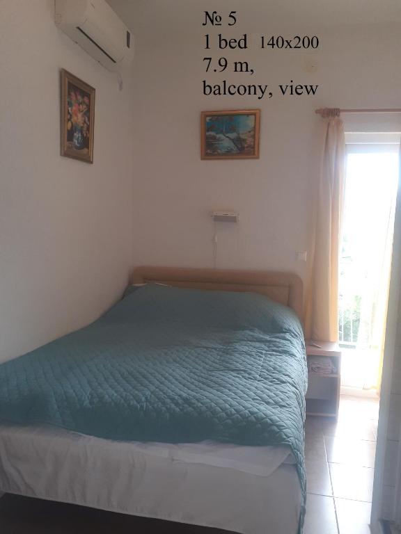 Postel nebo postele na pokoji v ubytování OLGA apartmani