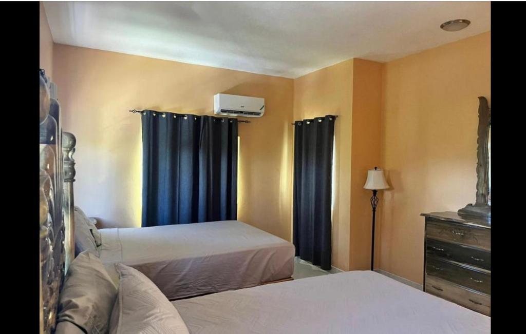 Postel nebo postele na pokoji v ubytování Indigo Beach Villa