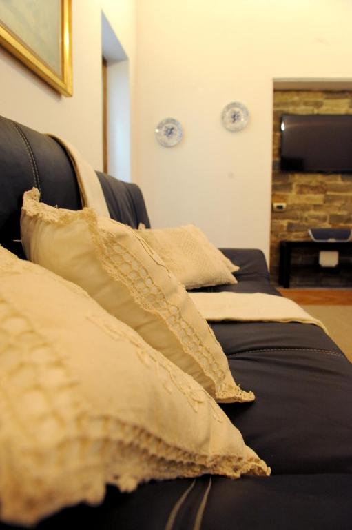A bed or beds in a room at ARIA DI CASA APARTMENT