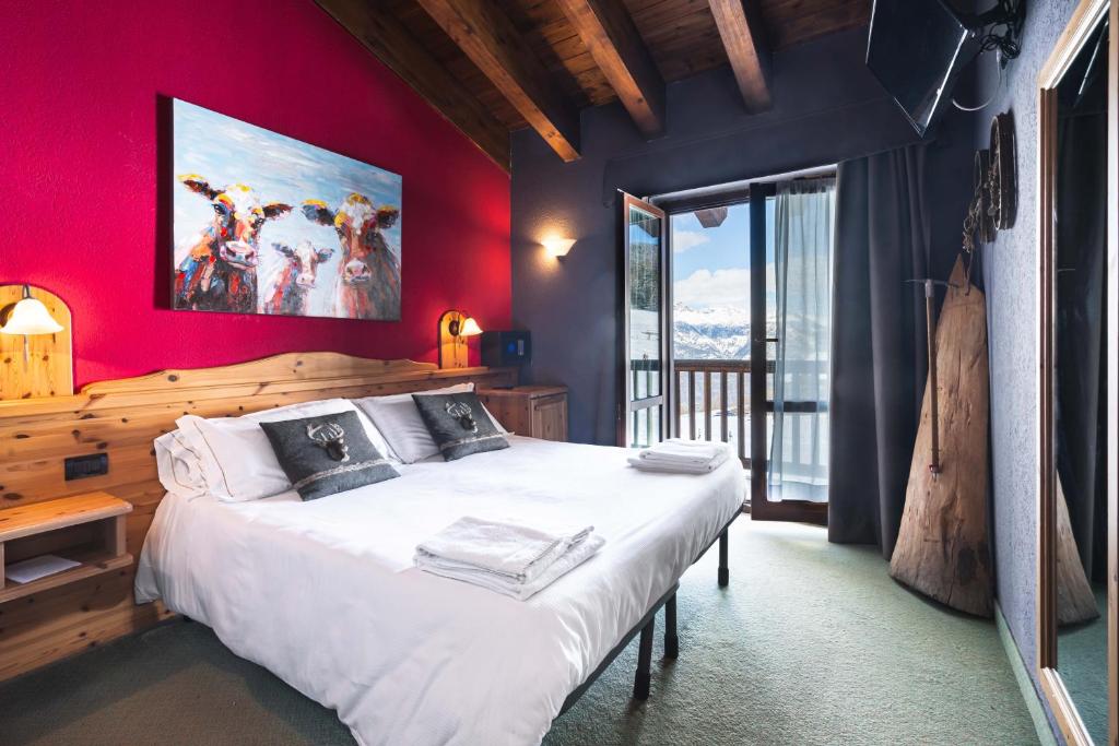 Postel nebo postele na pokoji v ubytování CHALET DES ALPES