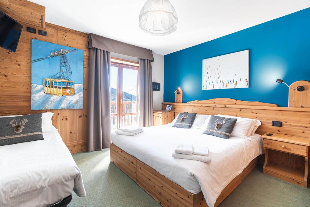 Postel nebo postele na pokoji v ubytování CHALET DES ALPES