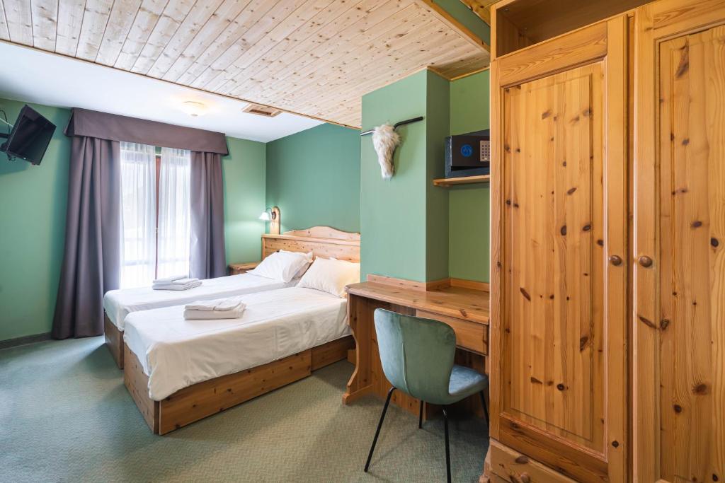 Postel nebo postele na pokoji v ubytování CHALET DES ALPES