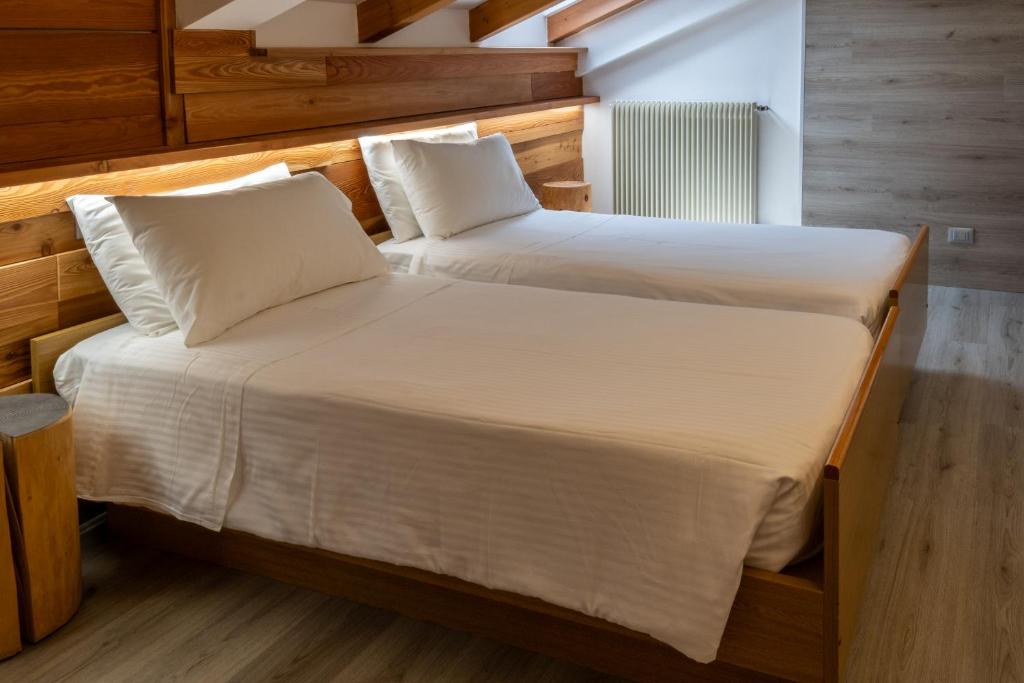 Postel nebo postele na pokoji v ubytování Hotel Garnì Zanella