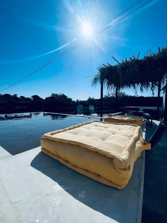 a mattress sitting on the side of a swimming pool at Monte da Lua in Montargil