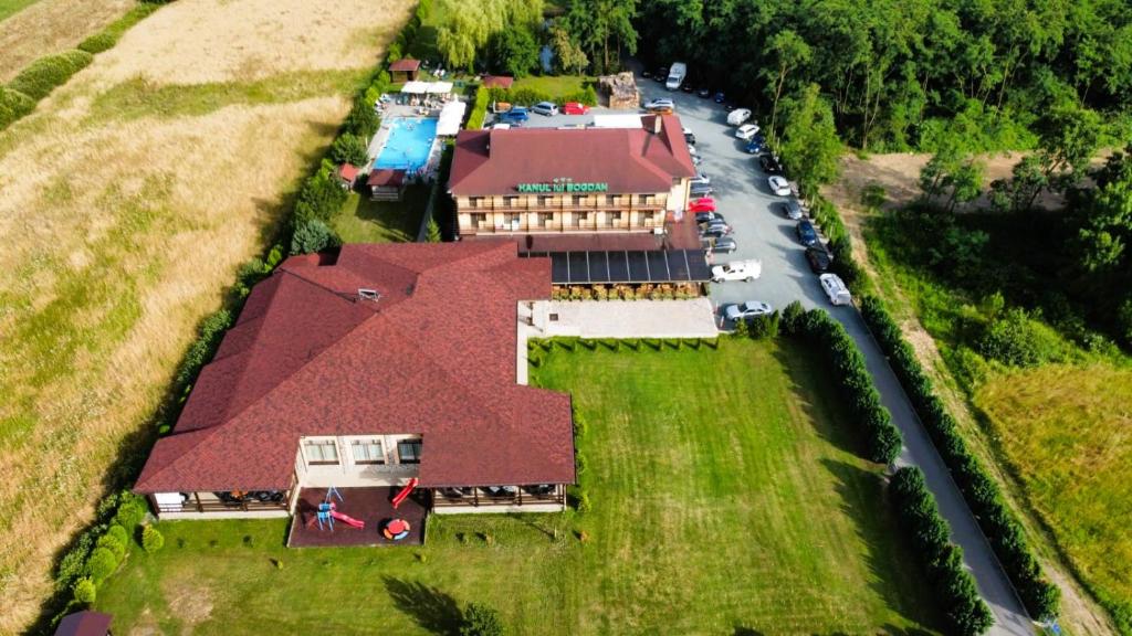 an aerial view of a house with a roof at Hanul Lui Bogdan Economy INN in Făget