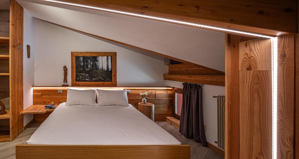 Postel nebo postele na pokoji v ubytování Hotel Garnì Zanella