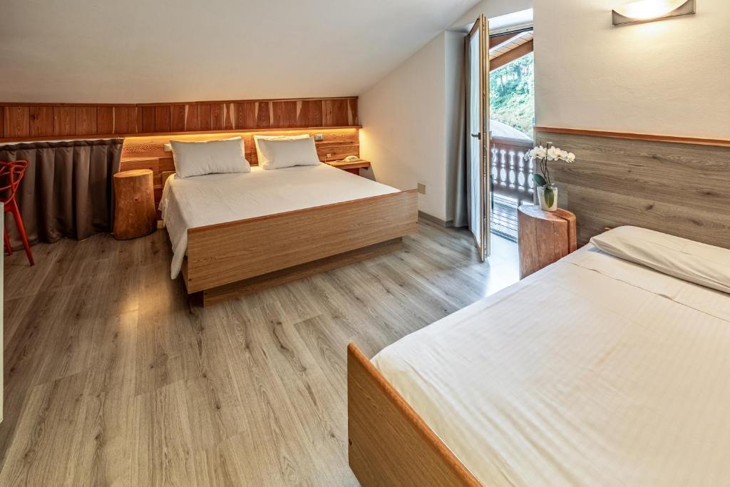 Postel nebo postele na pokoji v ubytování Hotel Garnì Zanella