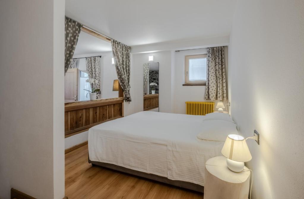 Postel nebo postele na pokoji v ubytování Hotel Garnì Zanella