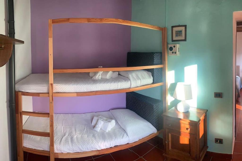 Postel nebo postele na pokoji v ubytování Palazzetto in centro