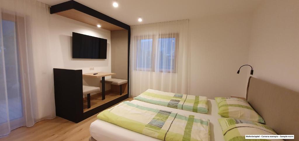 Postel nebo postele na pokoji v ubytování B&B Haus Grüner