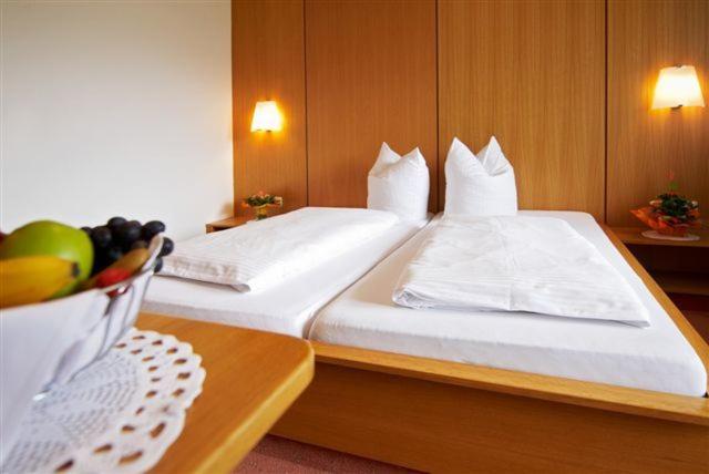 Postel nebo postele na pokoji v ubytování Hotel Silvretta