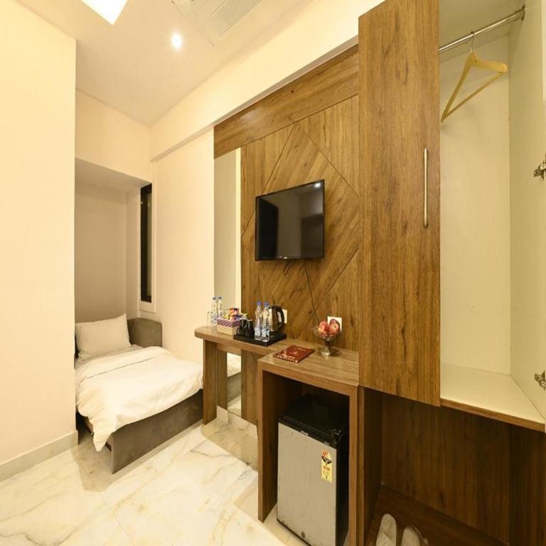 TV a/nebo společenská místnost v ubytování Hotel Avalon Palms Agra