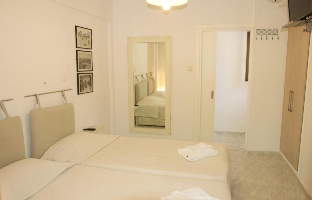 Postel nebo postele na pokoji v ubytování Mirto Apartments