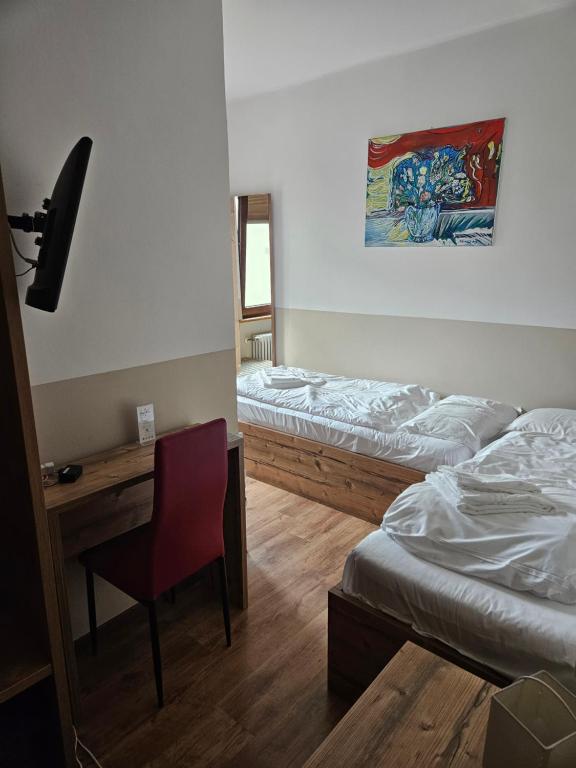 Posteľ alebo postele v izbe v ubytovaní Hotel Tarvisio Four Seasons