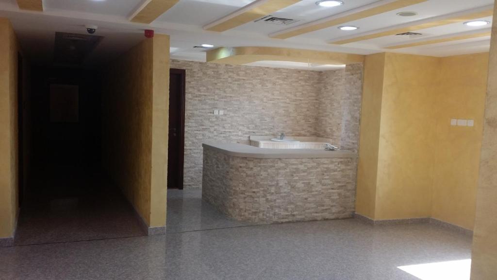 a bathroom with a sink in a room at Aryana Hotel in Al Buraymī