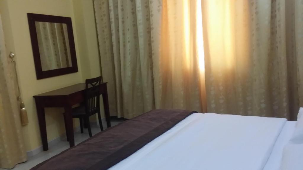 Postel nebo postele na pokoji v ubytování Aryana Hotel