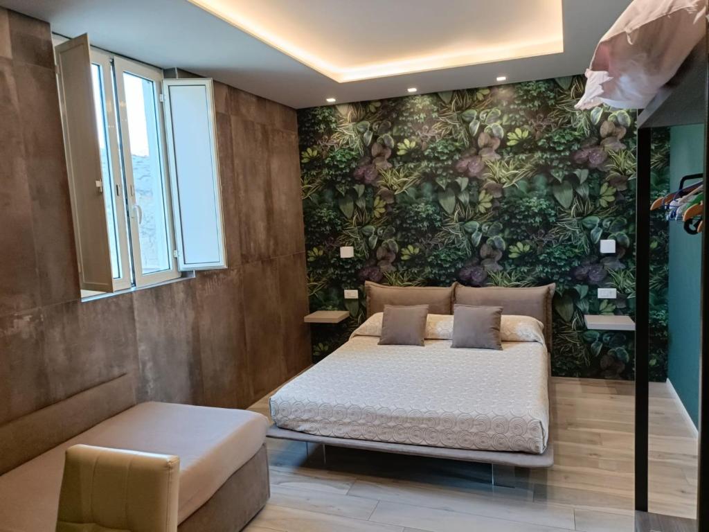 En eller flere senge i et værelse på B&B Portanuova