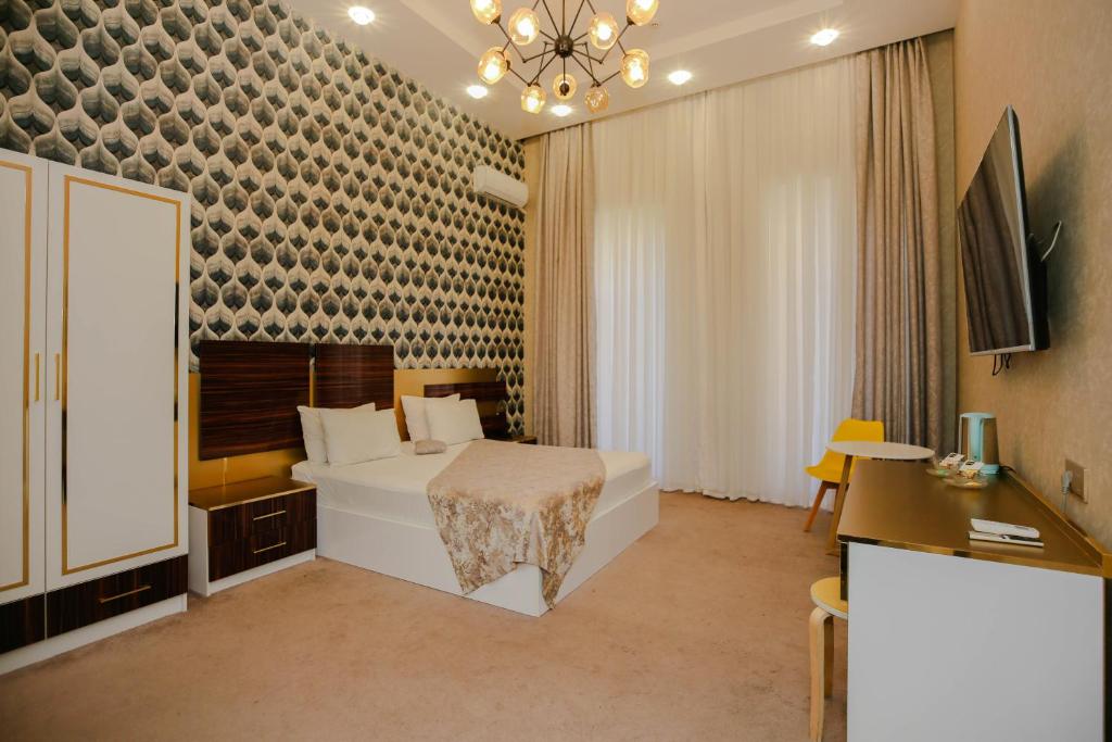 Llit o llits en una habitació de Dionis Hotel