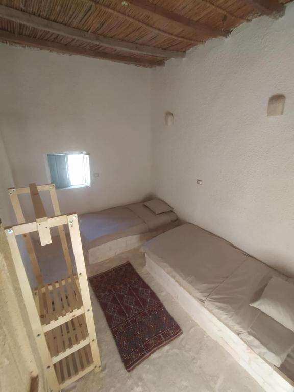 Postel nebo postele na pokoji v ubytování Lotus House