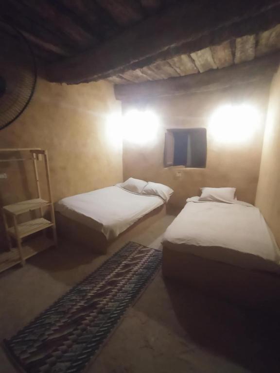 Postel nebo postele na pokoji v ubytování Lotus House