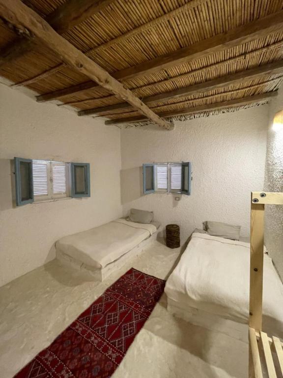 Postel nebo postele na pokoji v ubytování Lotus House