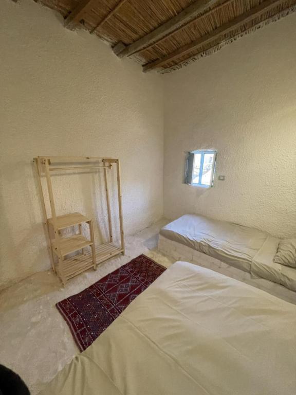Postel nebo postele na pokoji v ubytování Lotus House