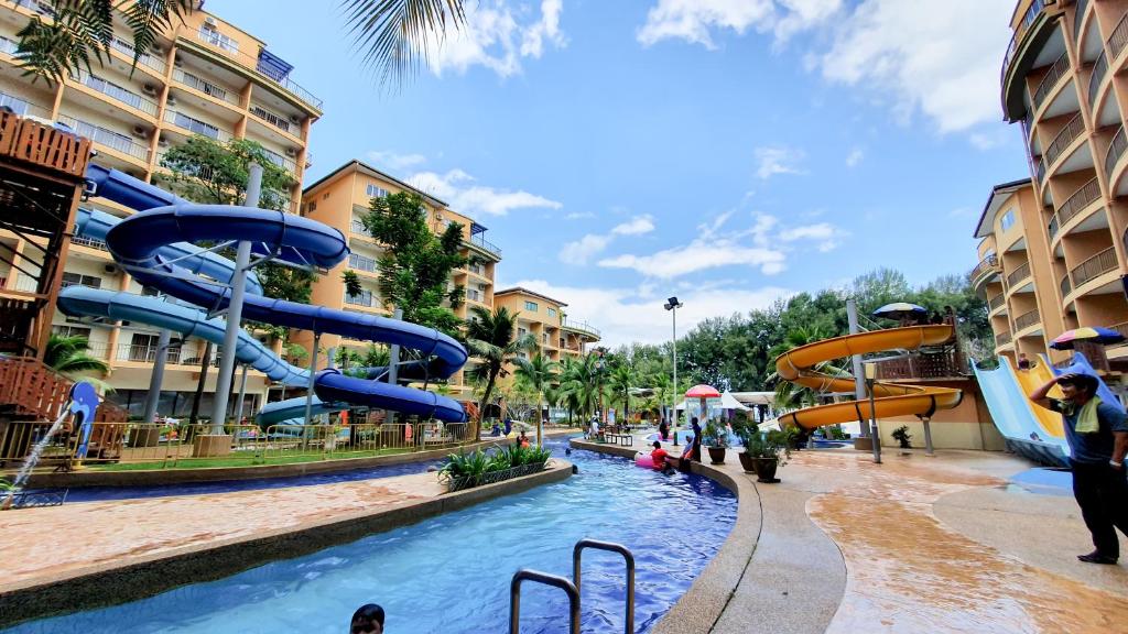 a water park with a slide in the middle at Gold Coast Morib Apartment in Banting