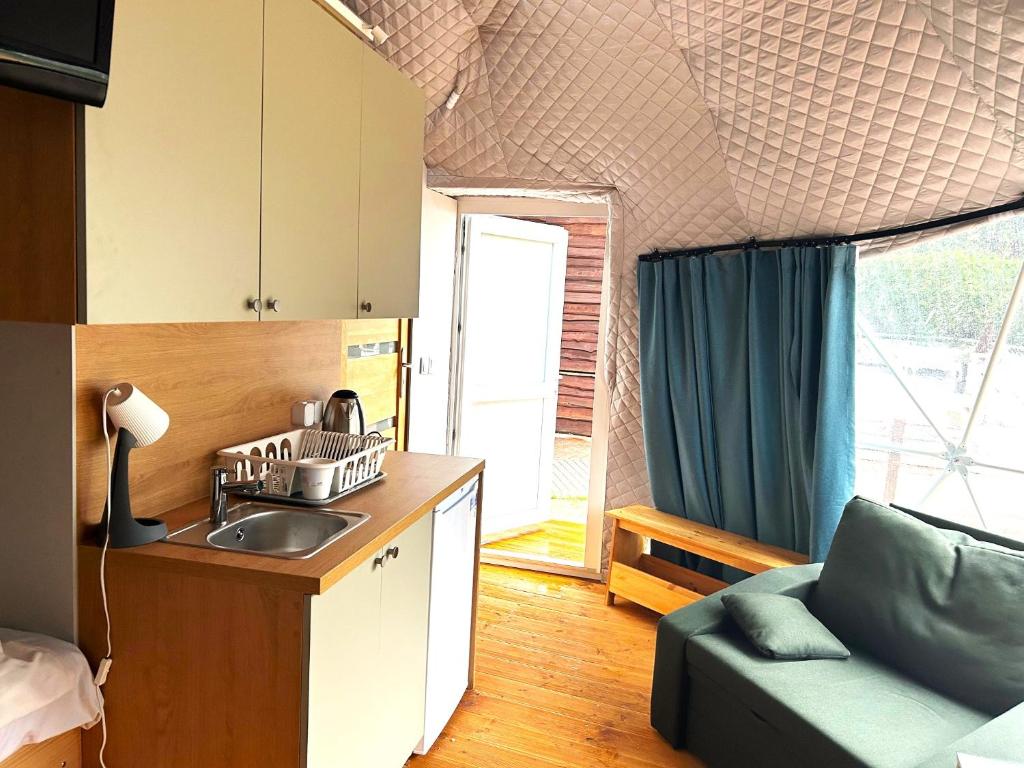 Kuchyň nebo kuchyňský kout v ubytování Stilo Hotel