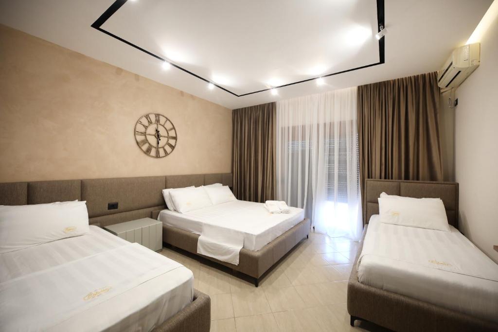 Postel nebo postele na pokoji v ubytování Hotel Erjuma
