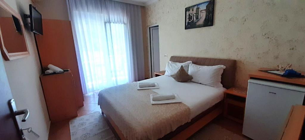 Postel nebo postele na pokoji v ubytování Apartmants Elisa