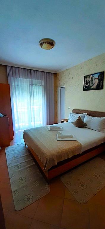 Postel nebo postele na pokoji v ubytování Apartmants Elisa