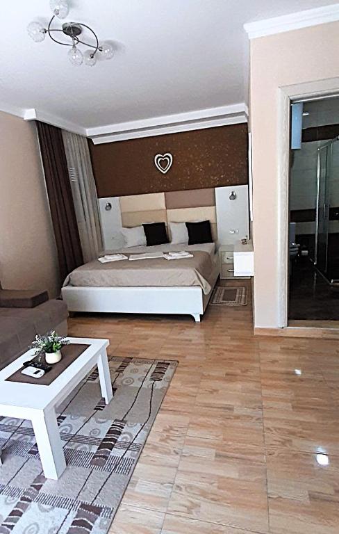 Postel nebo postele na pokoji v ubytování Apartmants Elisa