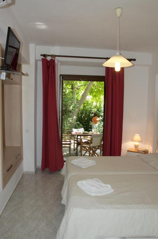 Postel nebo postele na pokoji v ubytování Mirto Apartments